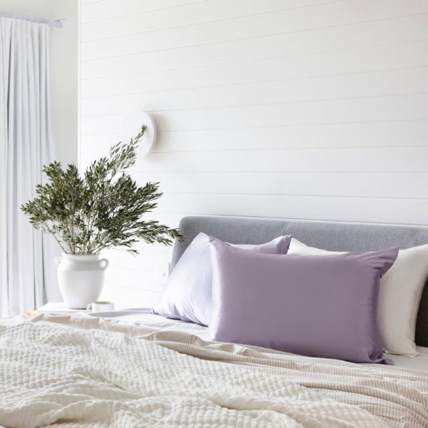 bed made up with lunalux silk pillowcase in lilac
